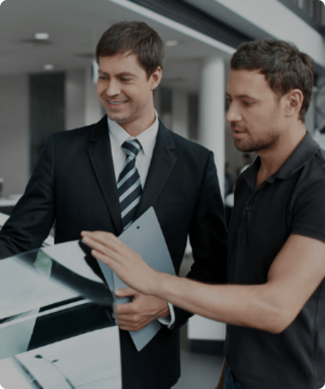 This image shows a chauffeur telling a customer about manner while using a limousine